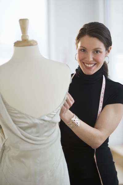 Portrait of young fashion designer at work.