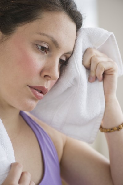 Tired young woman at fitness.