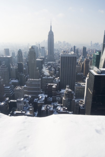 USA, New York City, View of Manhattan covered with snow, with Empire State Building in background.
