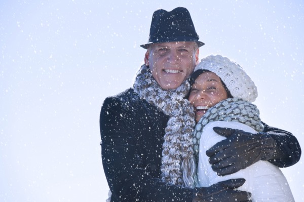 Happy mature couple in winter scenery.
