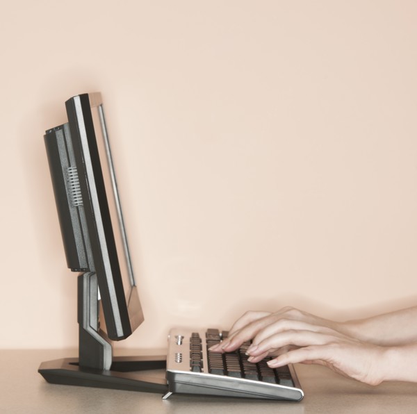 Studio shot of woman working on computer.