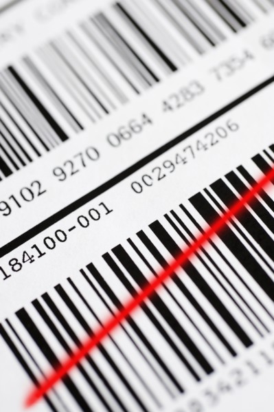 Close up of barcode with red line.