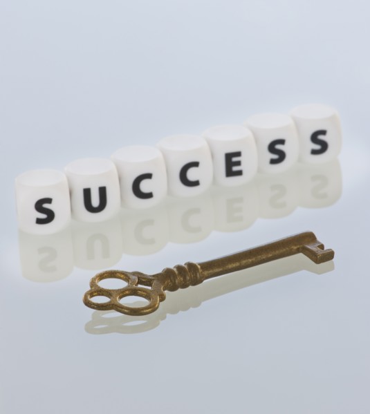 Studio shot of key and dice spelling out success. Photo: Daniel Grill