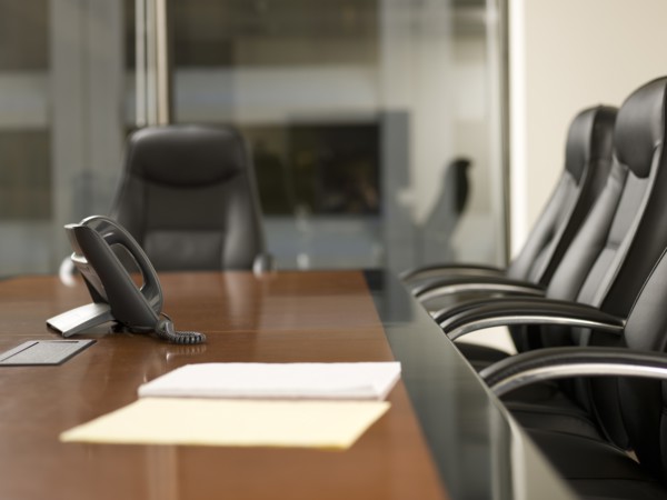 Paper and telephone in board room. Photo: Dan Bannister