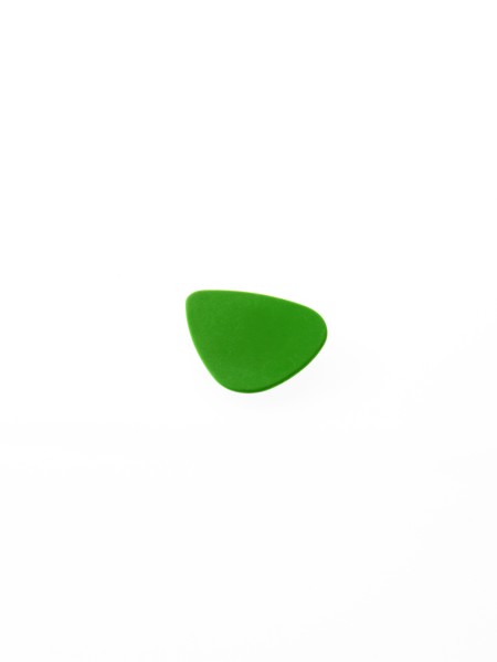 Green plectrum on white background. Photo: David Arky