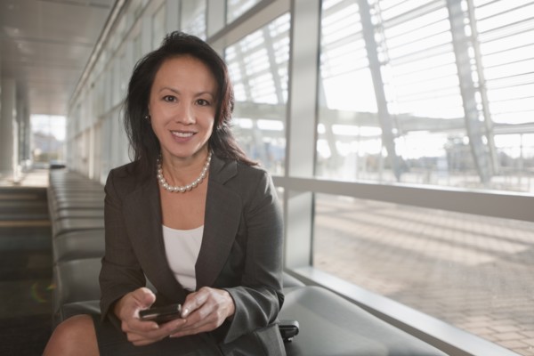 Businesswoman reading documents. Photo : Mark Edward Atkinson
