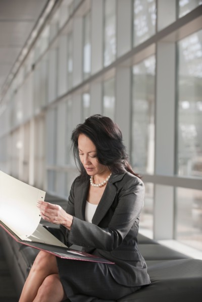 Businesswoman text-messaging. Photo: Mark Edward Atkinson