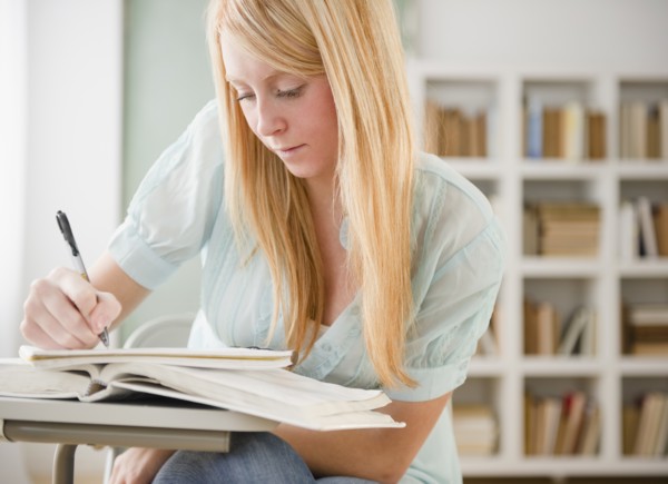 Female student doing homework. Photo : Jamie Grill Photography