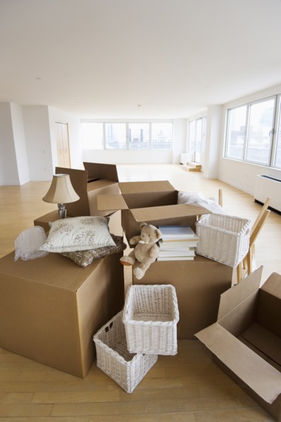 Boxes and decors stacked in room.