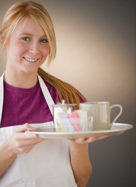 Waitress carrying tray with glass. Photo : Jamie Grill Photography