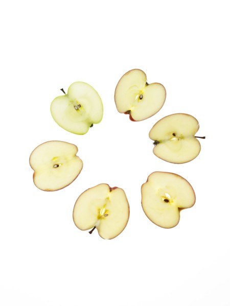 Apple slices on white background. Photo: David Arky