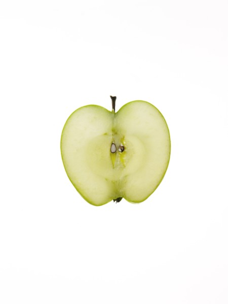 Apple slice on white background. Photo: David Arky