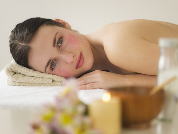 Woman lying on massage table. Photo: Daniel Grill