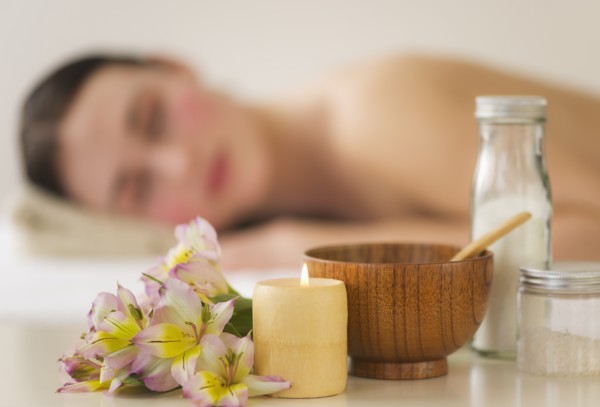 Spa accessories with woman in background. Photo : Daniel Grill