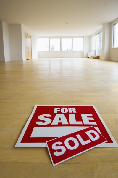 For sale sign in empty room.