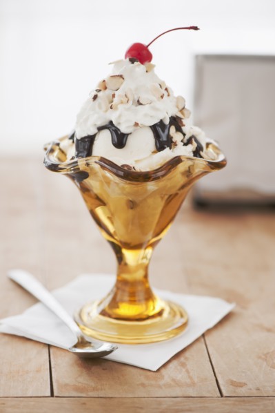 Close up of sundae with cherry on top.