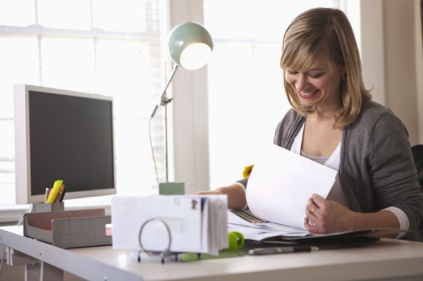 Woman working in office. Photo: DreamPictures