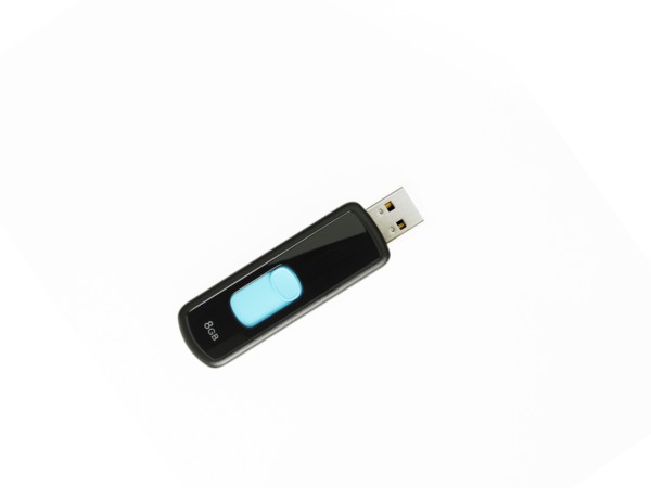 USB stick on white background. Photo : David Arky
