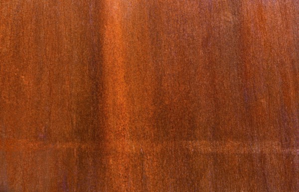 Close-up of brown wooden surface.