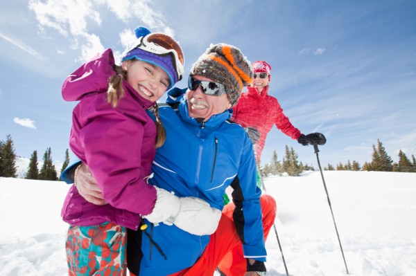 USA, Colorado, Telluride, Grandparents with girl (10-11) posing during ski holiday. Photo :