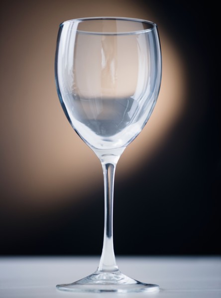 Close up of empty wine glass on black background. Photo : Jamie Grill Photography