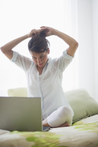Young attractive woman using laptop.
