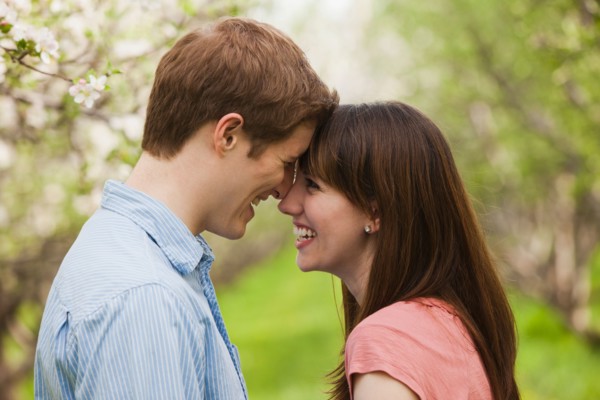 USA, Utah, Provo, Young couple face to face in orchard. Photo : Mike Kemp
