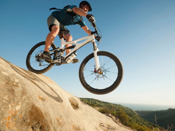 USA, California, Laguna Beach, Mountain biker riding downhill.