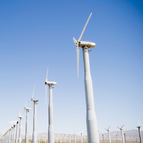 USA, California, Palm Springs, Coachella Valley, San Gorgonio Pass, Wind turbines against blue sky.