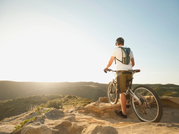 USA, California, Laguna Beach, Mountain biker on top of hill.