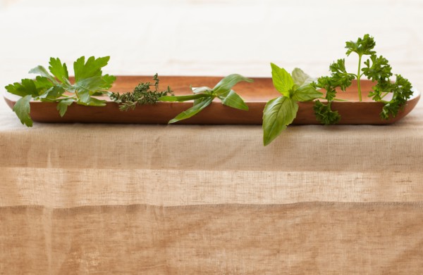 Fresh herbs on plate.