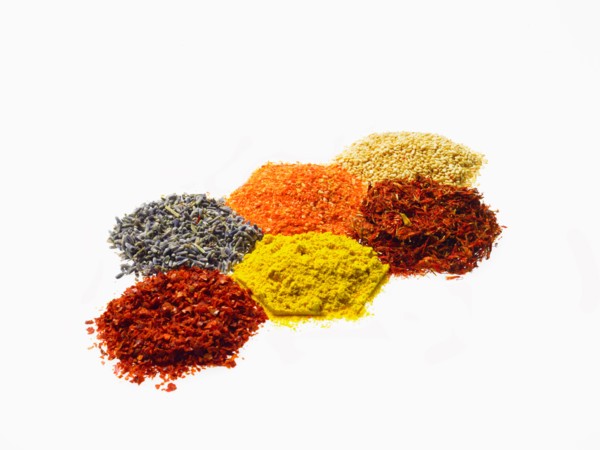 Studio shot of Piles of spice on white background. Photo : David Arky
