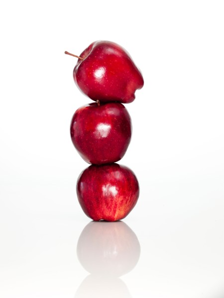 Apples on top of each other on digital tablet, studio shot. Photo : David Arky