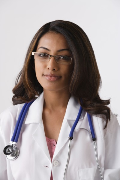 Portrait of young female doctor, studio shot. Photo : Rob Lewine