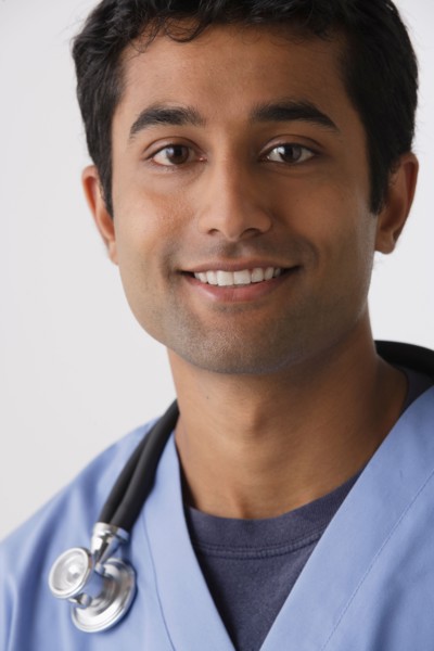 Portrait of young male nurse, studio shot. Photo : Rob Lewine