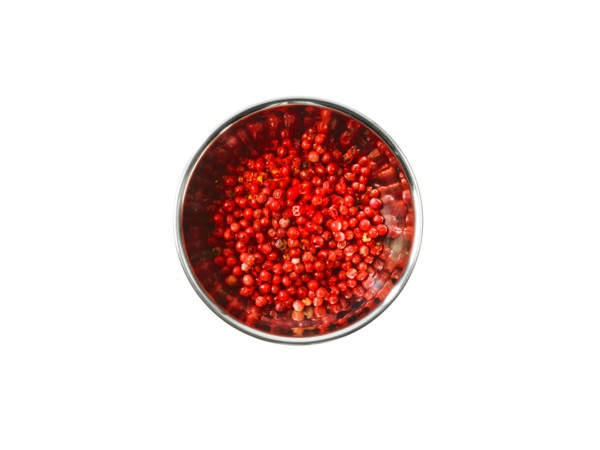 Studio shot of Red Chili Flakes in pan on white background. Photo : David Arky