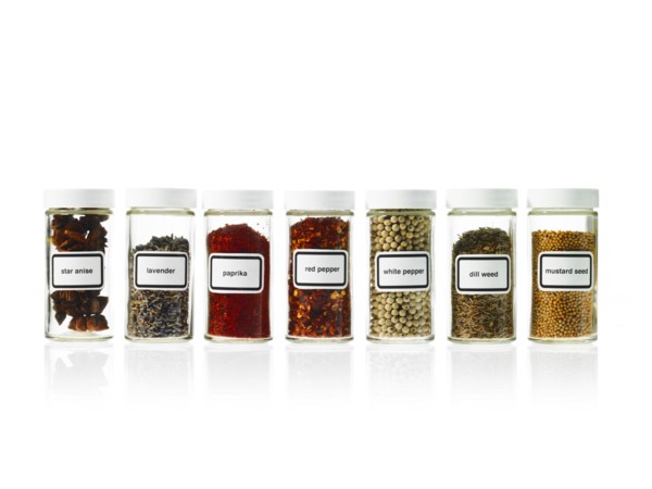 Studio shot of Jars with spices on white background. Photo : David Arky