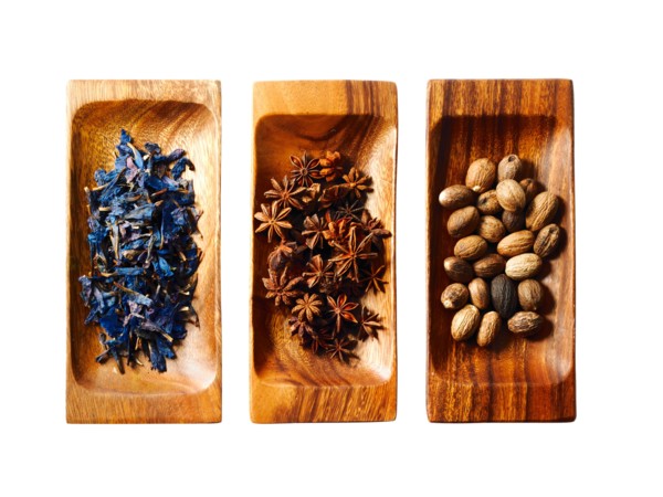 Studio shot of star anise, nutmeg and lavender on wooden trays. Photo : David Arky