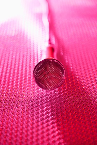 Close up of microphone lying on stage. Photo : Daniel Grill