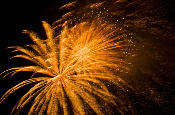 Fireworks explosion against night sky.