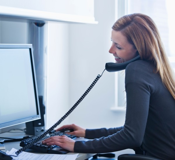 Young woman working in office. Photo: Daniel Grill