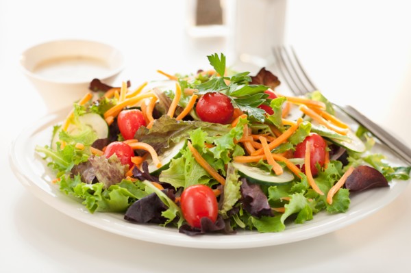Fresh salad on plate.