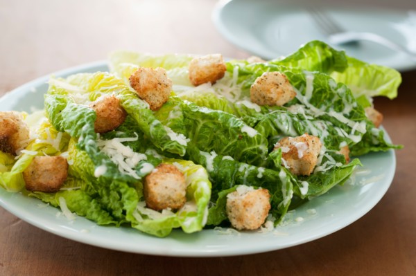 Fresh caesar salad on plate.