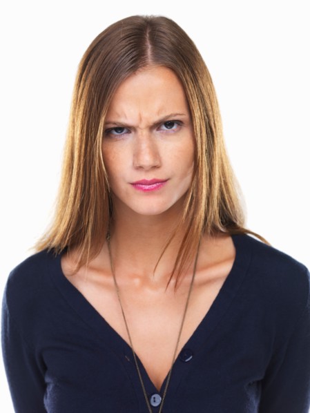 Studio portrait of irritated woman. Photo: momentimages