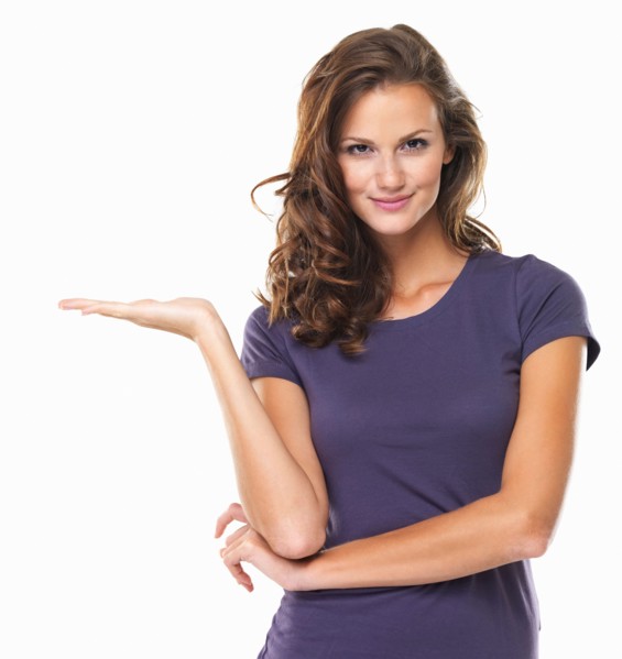 Studio portrait of attractive young woman gesturing and smiling. Photo : momentimages
