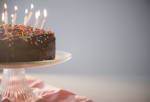 Close up of chocolate birthday cake with candles. Photo : Jamie Grill