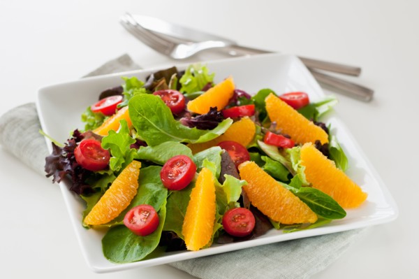 Fresh salad on plate.