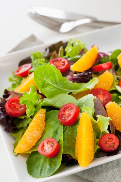 Fresh salad on plate.