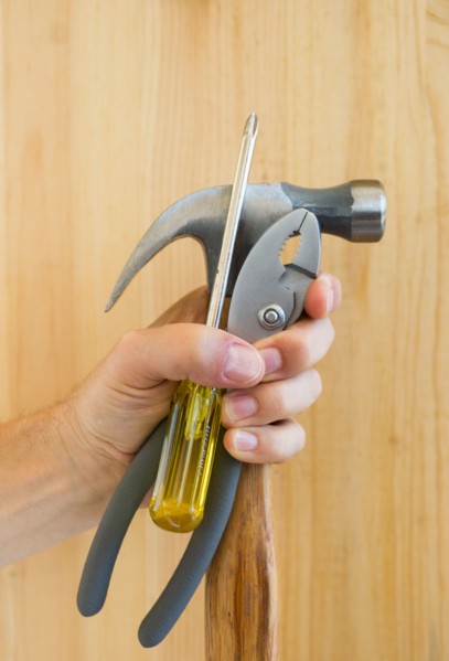 Hand holding tools.