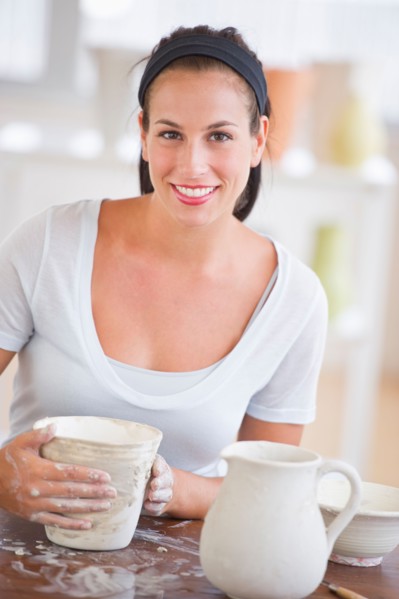 Woman making pottery.